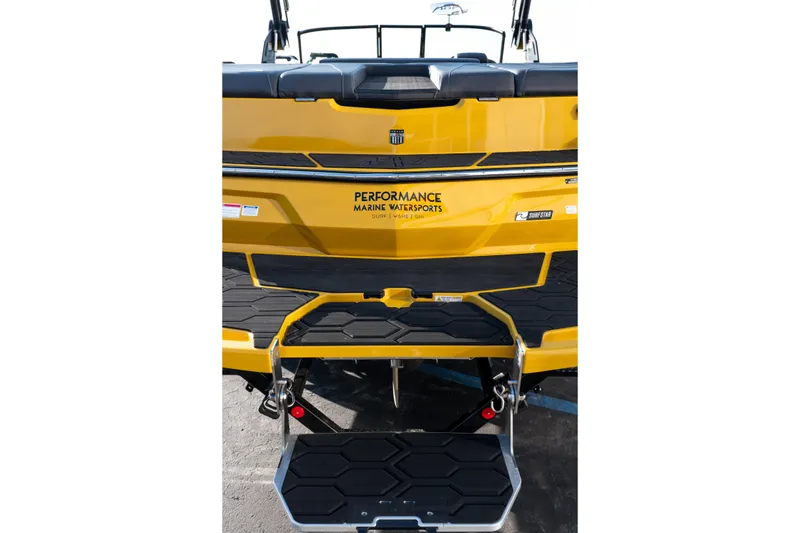 Slide: The Image of 2026 MasterCraft NXT23 boat rear view with yellow finish and performance features. - 44