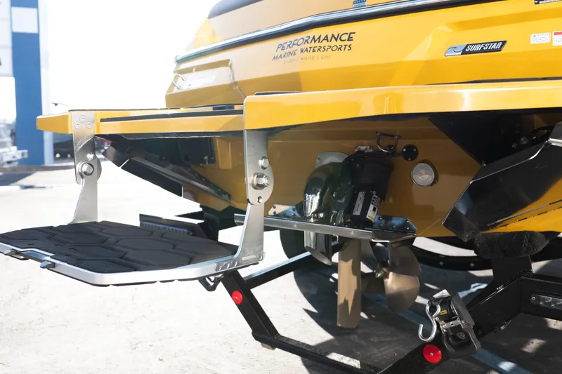 Slide: The Image of 2026 MasterCraft NXT23 boat rear view with SurfStar technology and performance features. - 8