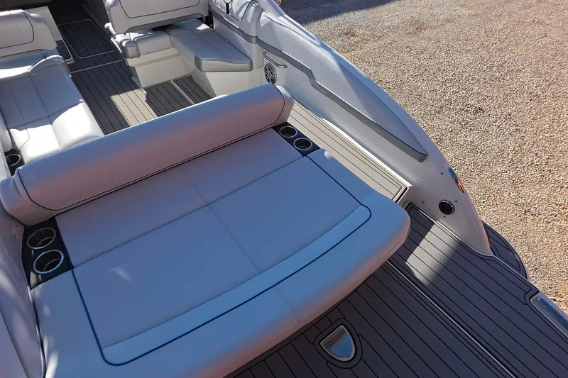 Slide: The Image of 2021 Formula 270 Bowrider interior with spacious seating and cup holders. - 11