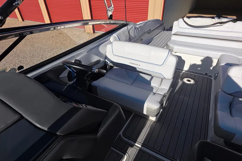 Slide: The Image of Interior of a 2021 Formula 270 Bowrider boat with sleek seating and modern design. - 19