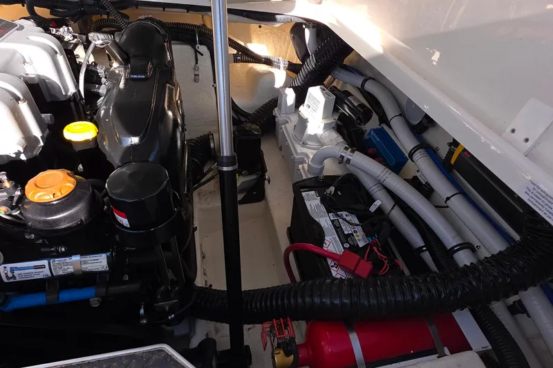 Slide: The Image of Engine compartment of a 2021 Formula 270 Bowrider, showcasing mechanical components and wiring. - 23