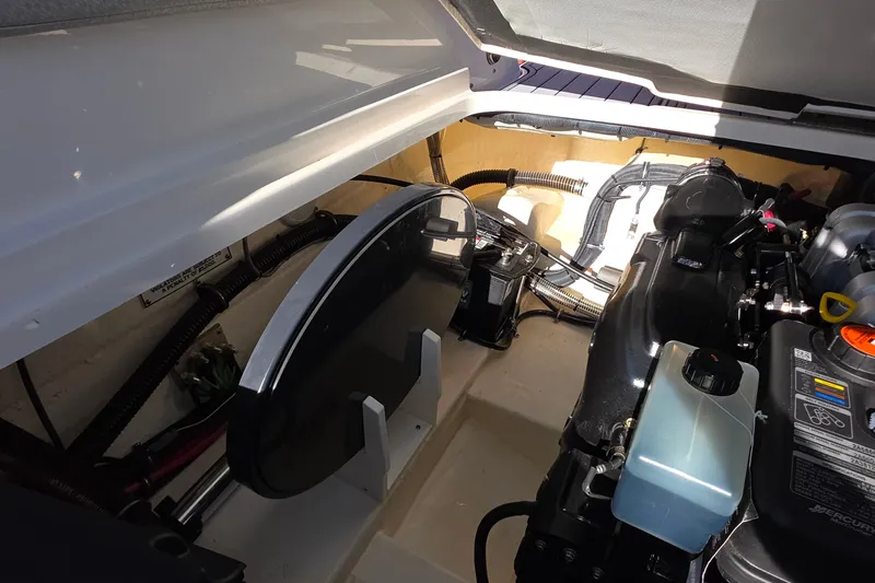 Slide: The Image of Engine compartment of a 2021 Formula 270 Bowrider boat, showcasing mechanical components. - 25