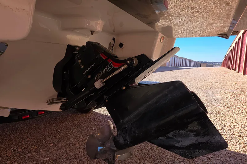 Slide: The Image of 2021 Formula 270 Bowrider boat stern drive and propeller in storage area. - 27