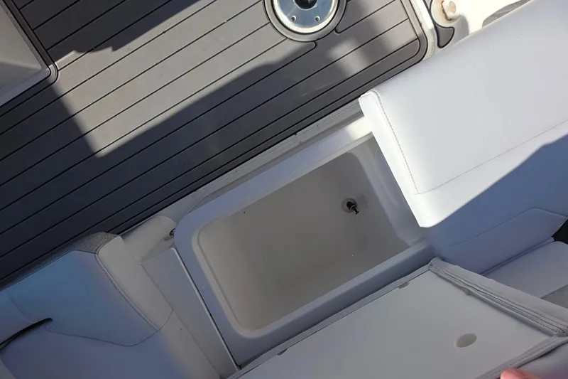 Slide: The Image of 2021 Formula 270 Bowrider interior storage compartment with gray deck flooring. - 37