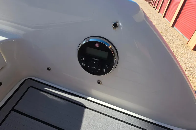 Slide: The Image of 2021 Formula 270 Bowrider boat dashboard with Clarion audio control panel. - 38