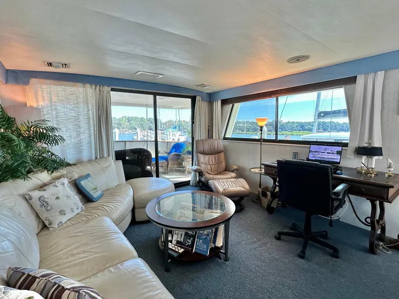 Slide: The Image of Luxurious interior of 1987 Hatteras 54 Motoryacht with leather seating and scenic views. - 13