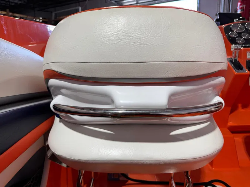 Slide: The Image of 2007 Baja 35 Outlaw boat seat with white leather and chrome accents. - 10
