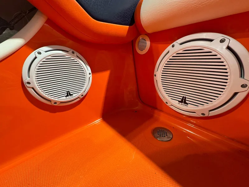 Slide: The Image of Orange interior of 2007 Baja 35 Outlaw with white marine speakers. - 13