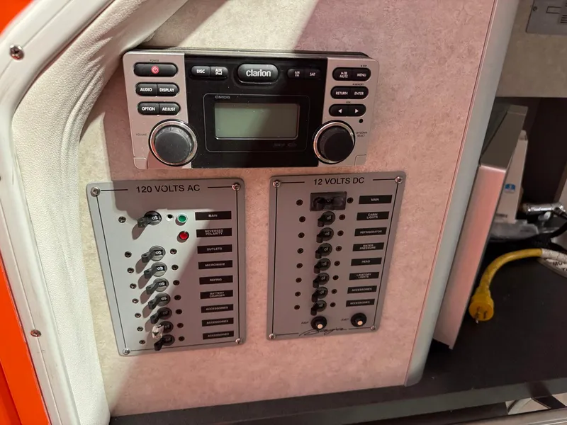 Slide: The Image of 2007 Baja 35 Outlaw control panel with Clarion stereo and AC/DC switches. - 17