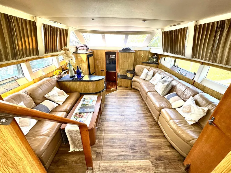 Slide: The Image of Luxurious interior of 2001 Carver 396 Motor Yacht with plush seating and elegant decor. - 13