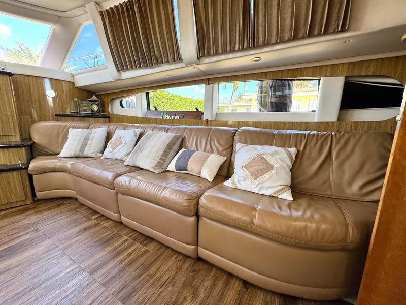 Slide: The Image of Luxurious interior of 2001 Carver 396 Motor Yacht with leather seating and decorative pillows. - 17