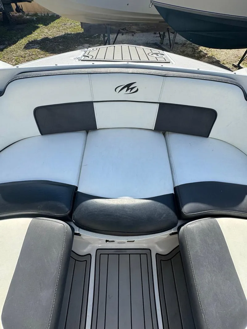 Slide: The Image of 2020 Monterey M45 boat interior with black and white seating. - 11
