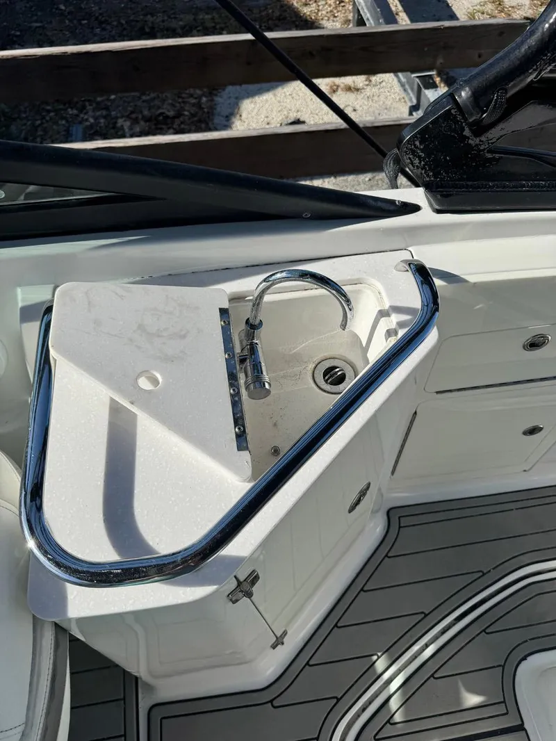 Slide: The Image of 2020 Monterey M45 boat sink with chrome faucet and storage cabinet. - 20
