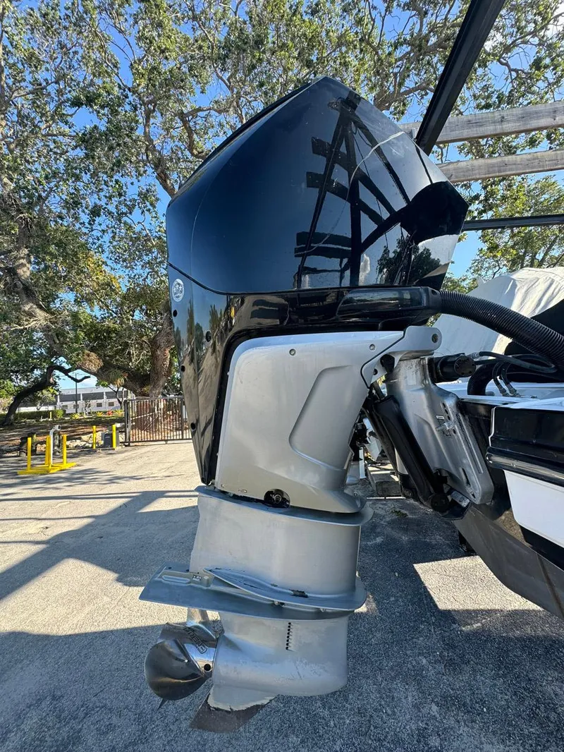 Slide: The Image of 2020 Monterey M45 outboard motor, sleek design, parked outdoors with trees in the background. - 24
