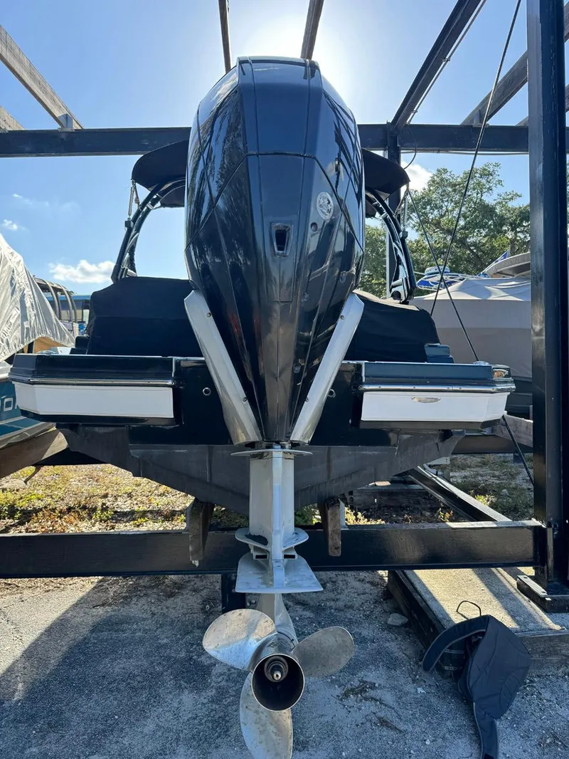 Slide: The Image of 2020 Monterey M45 boat on a lift, rear view with propeller visible. - 26