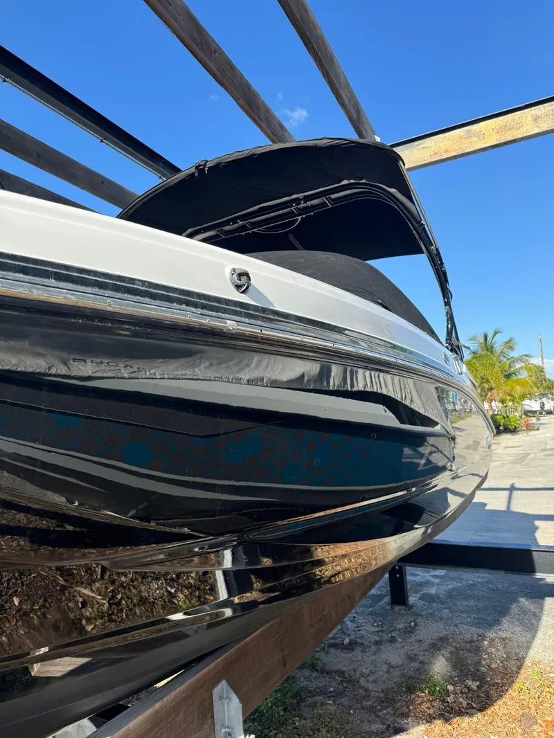 Slide: The Image of 2020 Monterey M45 boat on trailer under clear blue sky. - 28