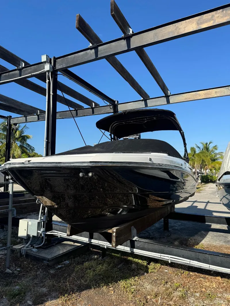 Slide: The Image of 2020 Monterey M45 boat on a lift under a clear blue sky. - 29