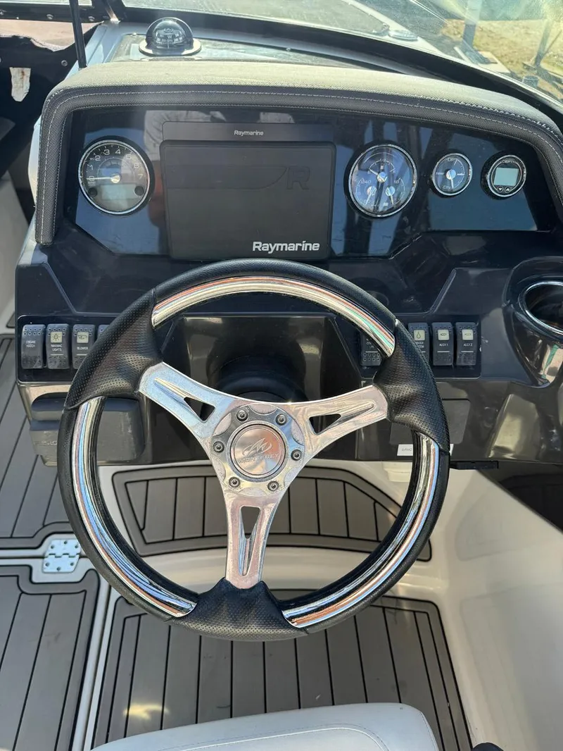Slide: The Image of Steering wheel and dashboard of a 2020 Monterey M45 boat with Raymarine display. - 6