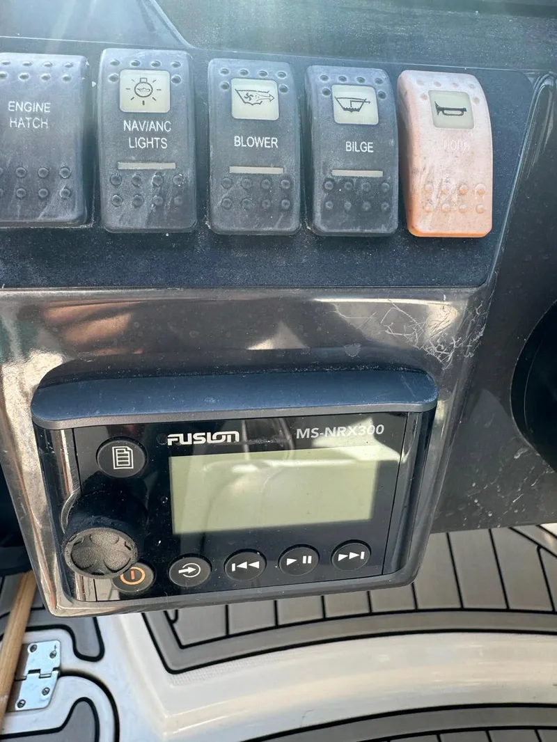 Slide: The Image of Control panel of a 2020 Monterey M45 boat with switches and a Fusion MS-RA60 stereo. - 7