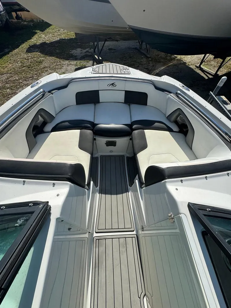 Slide: The Image of 2020 Monterey M45 boat interior with cushioned seating and sleek design. - 9