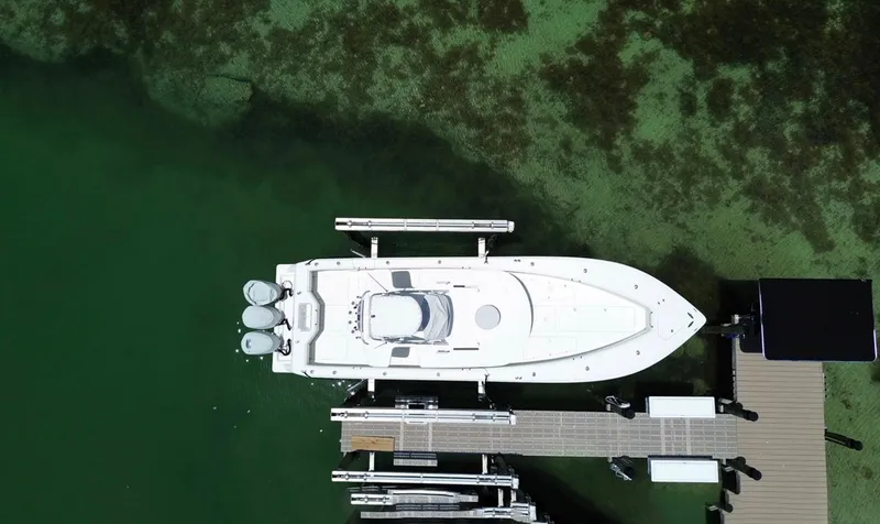 Slide: The Image of Aerial view of 2014 SeaVee 390B Center Console docked in clear green water. - 1