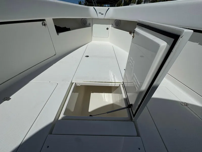 Slide: The Image of 2014 SeaVee 390B Center Console boat interior with open storage compartments. - 10