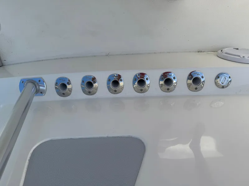 Slide: The Image of 2014 SeaVee 390B Center Console boat with multiple rod holders on deck. - 13