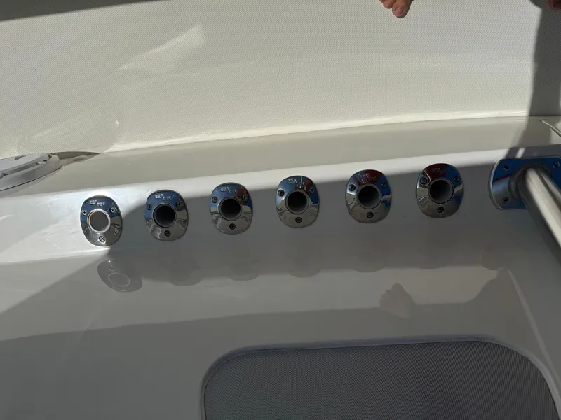 Slide: The Image of 2014 SeaVee 390B Center Console boat rod holders on deck. - 14