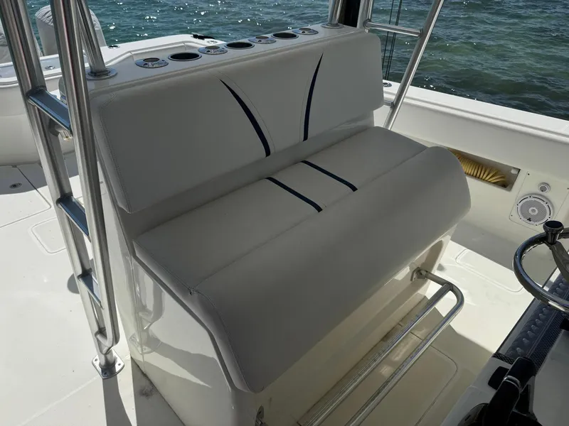 Slide: The Image of 2014 SeaVee 390B Center Console boat interior with cushioned seating and ocean view. - 28