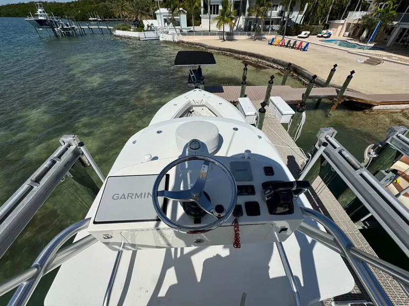 Slide: The Image of 2014 SeaVee 390B Center Console boat docked, featuring Garmin navigation system. - 31