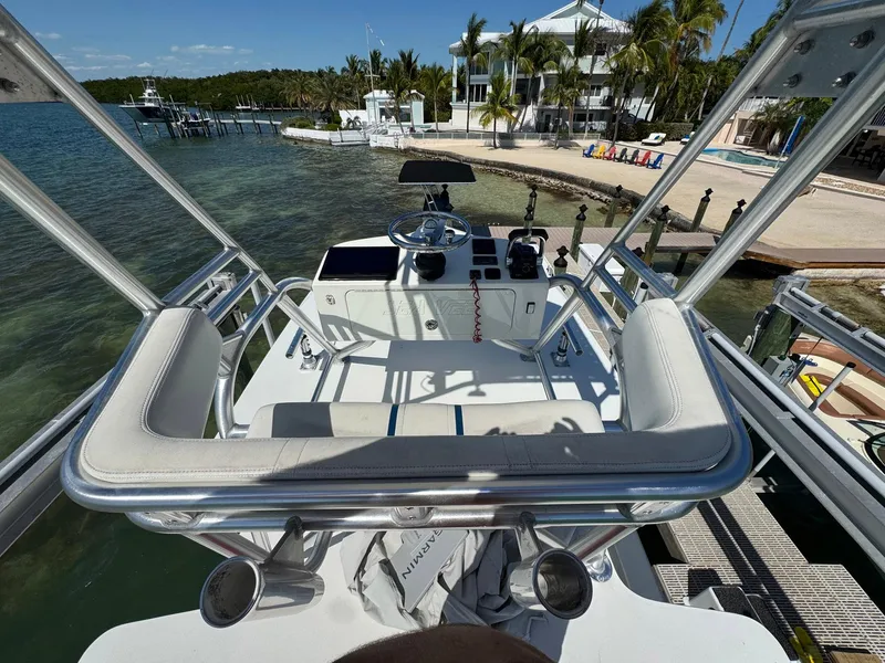 Slide: The Image of 2014 SeaVee 390B Center Console boat docked near a tropical waterfront home. - 34
