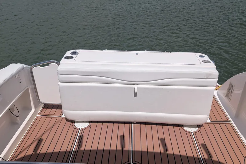 Slide: The Image of 2008 Sea Ray 340 Sundancer boat deck with white seating and cup holders. - 4