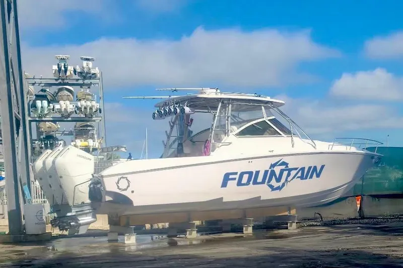 The Image of 2017 Fountain 38 Sportfish Cruiser boat on dry dock, urban background. - 0
