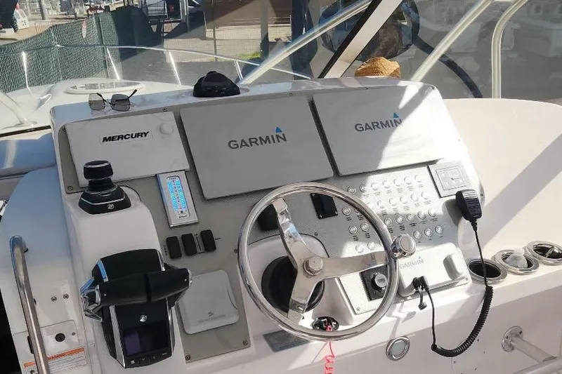 Slide: The Image of 2017 Fountain 38 Sportfish Cruiser outboard motor and propeller detail. - 2