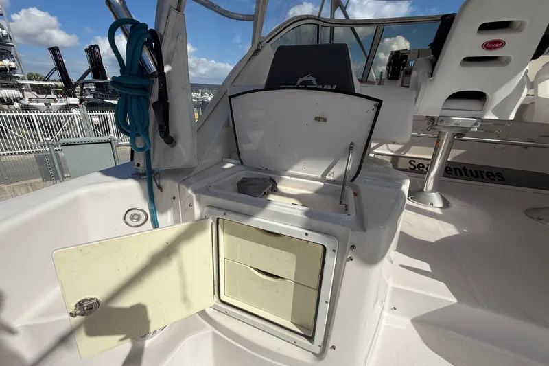 Slide: The Image of 2017 Fountain 38 Sportfish Cruiser interior with open storage compartments and seating. - 21