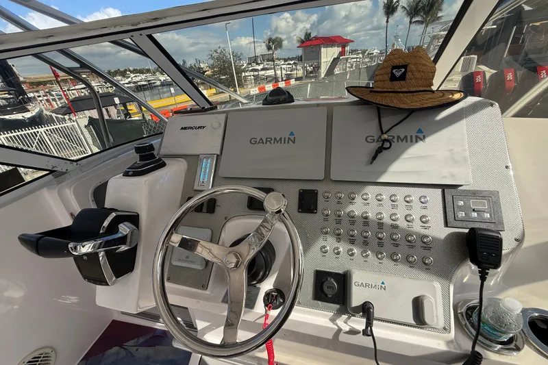 Slide: The Image of Control panel of a 2017 Fountain 38 Sportfish Cruiser with Garmin navigation systems. - 32