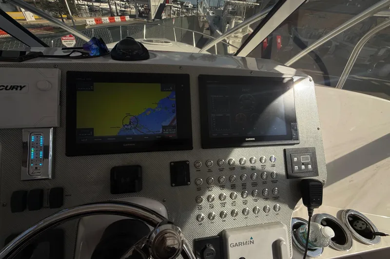 Slide: The Image of Helm of 2017 Fountain 38 Sportfish Cruiser with Garmin navigation displays. - 37