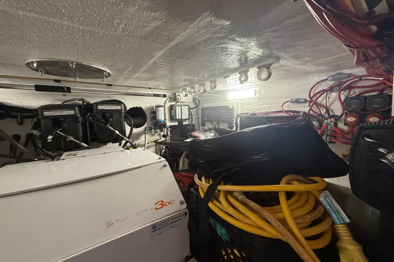 Slide: The Image of Engine room of 2017 Fountain 38 Sportfish Cruiser with equipment and wiring. - 48