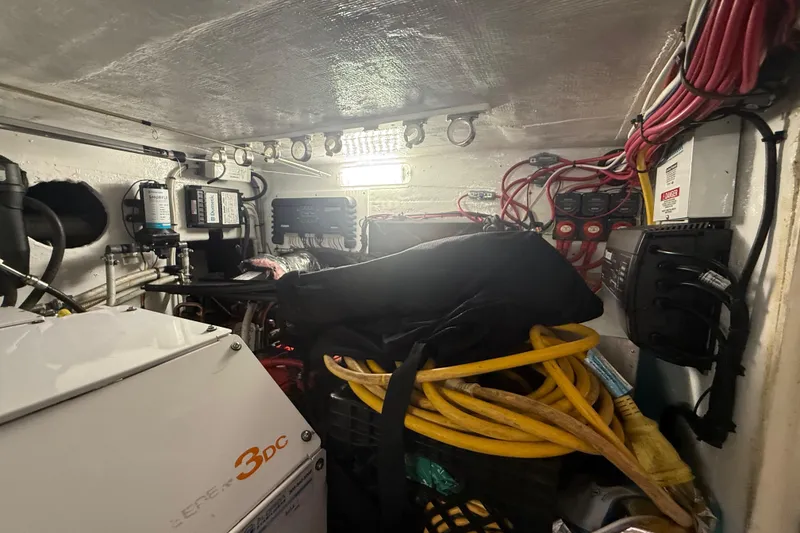 Slide: The Image of Engine room of 2017 Fountain 38 Sportfish Cruiser with cables and equipment. - 49