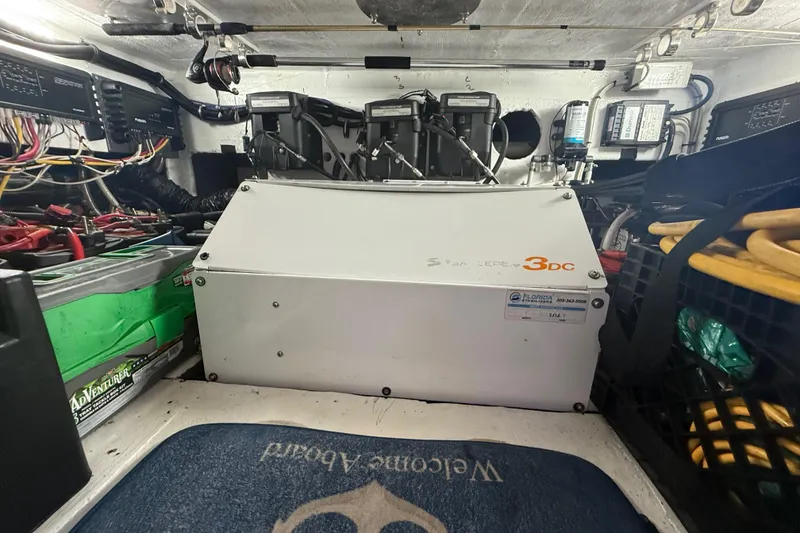 Slide: The Image of Engine room of a 2017 Fountain 38 Sportfish Cruiser with electrical components and wiring. - 50