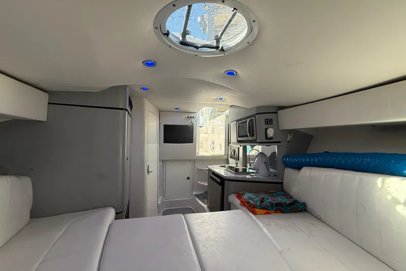 Slide: The Image of Interior of 2017 Fountain 38 Sportfish Cruiser with modern amenities and white seating. - 51