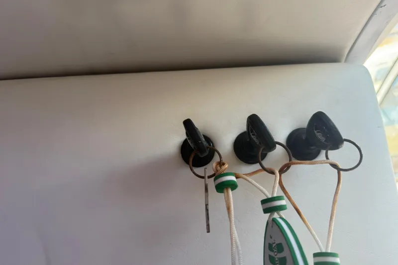 Slide: The Image of Keys hanging on a 2017 Fountain 38 Sportfish Cruiser interior wall. - 56