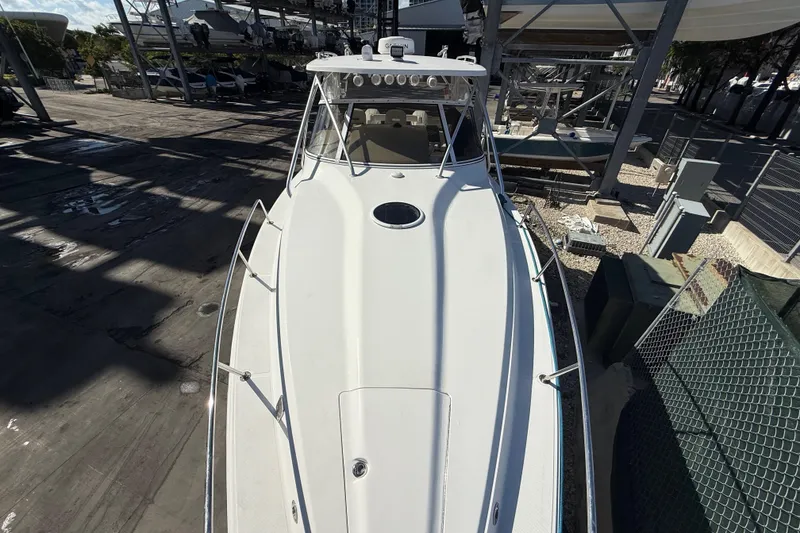 Slide: The Image of 2017 Fountain 38 Sportfish Cruiser docked, top view showcasing sleek design and spacious deck. - 59