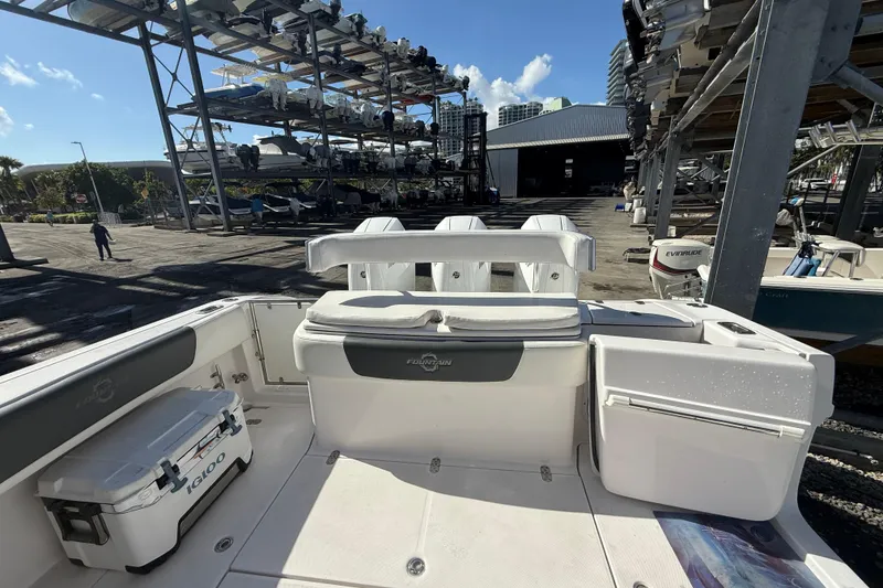 Slide: The Image of 2017 Fountain 38 Sportfish Cruiser docked with storage racks in background. - 6