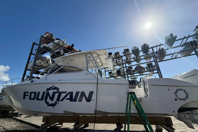 Slide: The Image of 2017 Fountain 38 Sportfish Cruiser boat in storage under bright sun. - 63