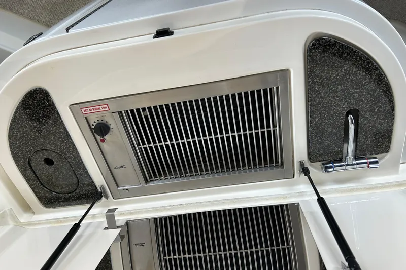 Slide: The Image of 2005 Cruisers 500 yacht grill and sink setup with modern design. - 16