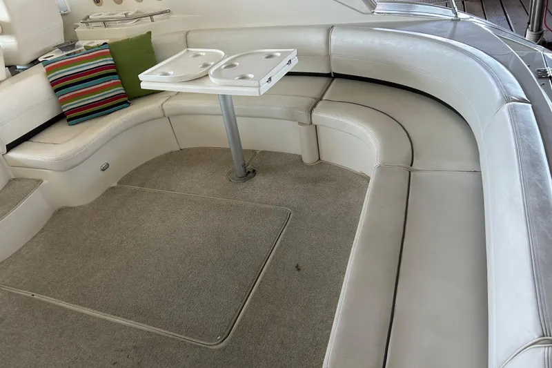 Slide: The Image of Luxurious 2005 Cruisers 500 yacht interior with white seating and colorful cushions. - 15