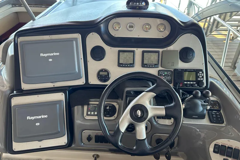 Slide: The Image of Helm of 2005 Cruisers 500 yacht with Raymarine navigation systems and controls. - 20