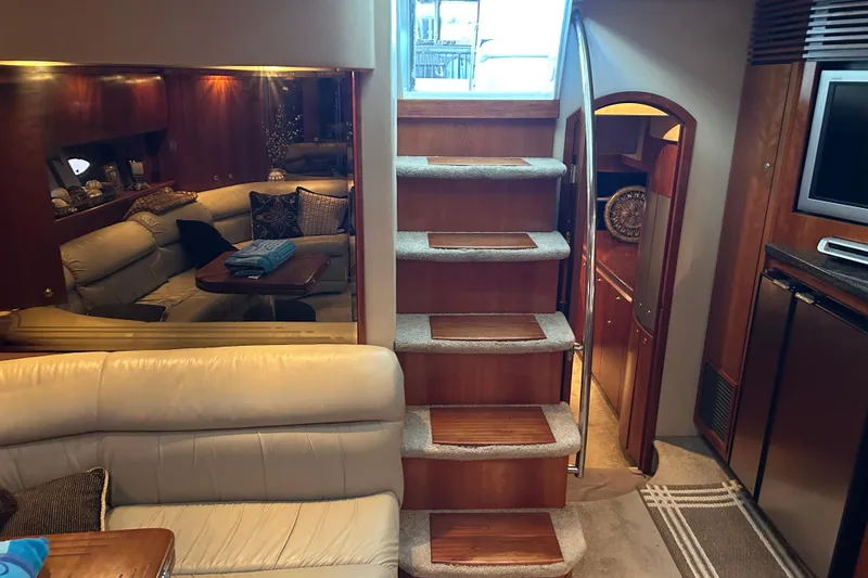 Slide: The Image of Luxurious interior of a 2005 Cruisers 500 yacht with elegant wood and leather furnishings. - 28