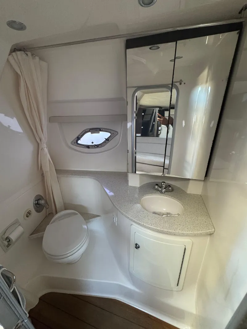 Slide: The Image of 2016 Regal 35 Sport Coupe bathroom with modern fixtures and compact design. - 23
